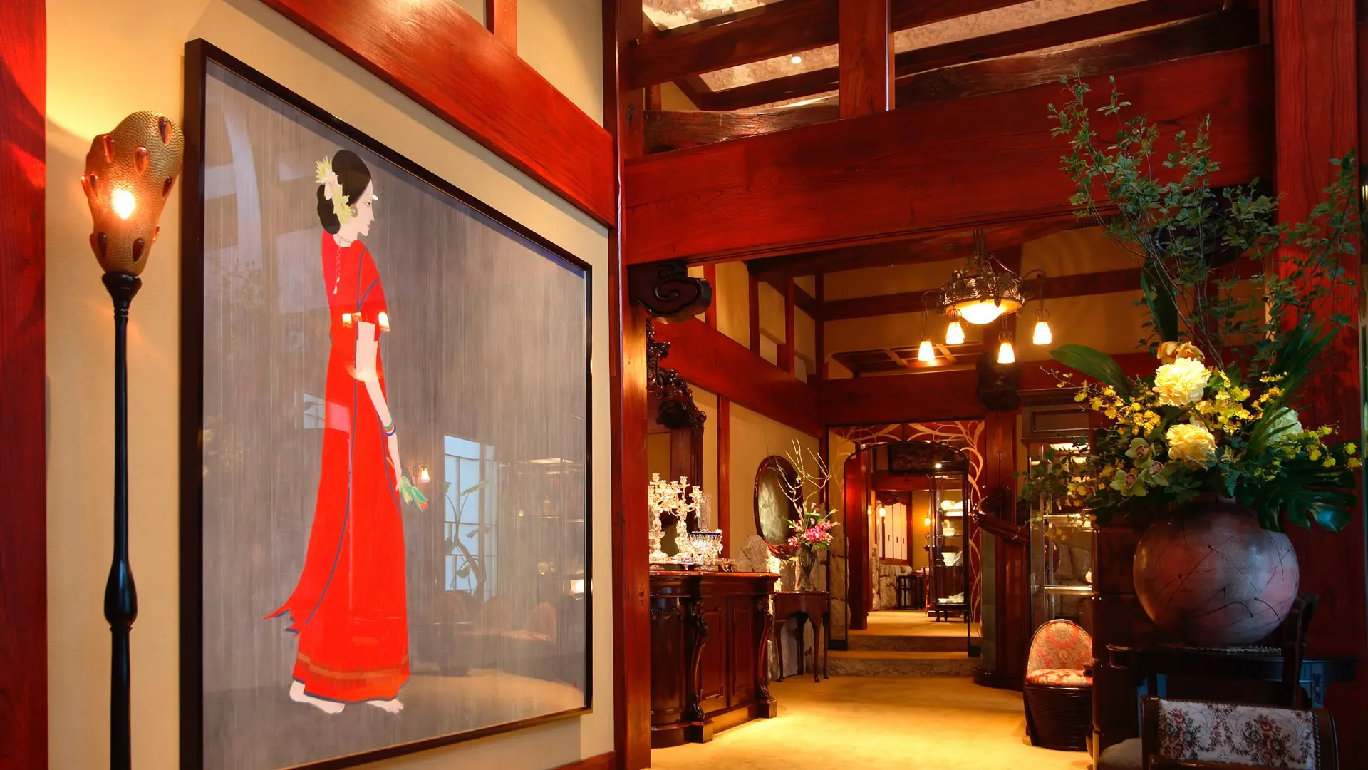 Red decored walls, painting and lightning at Ginza Ukai-Tei in Tokyo.