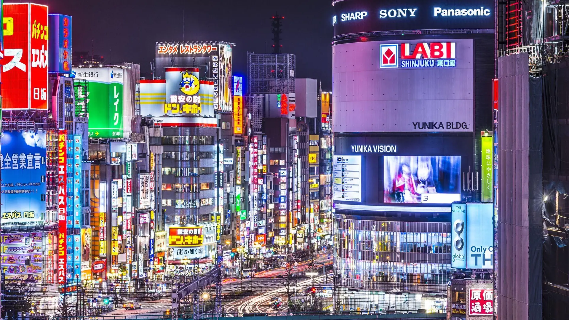Artificial lightning, advertisements, and bust street Tokyo Nightlife.