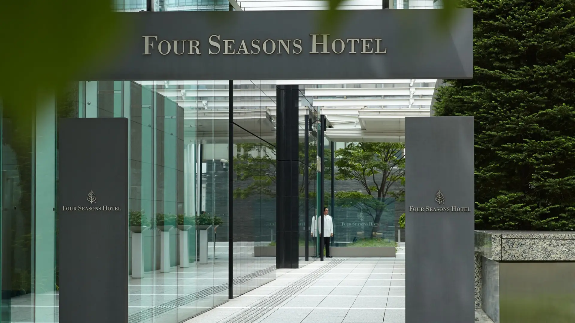 Four seasons hotel at Tokyo, grey and white entrance design with futuristic decor.